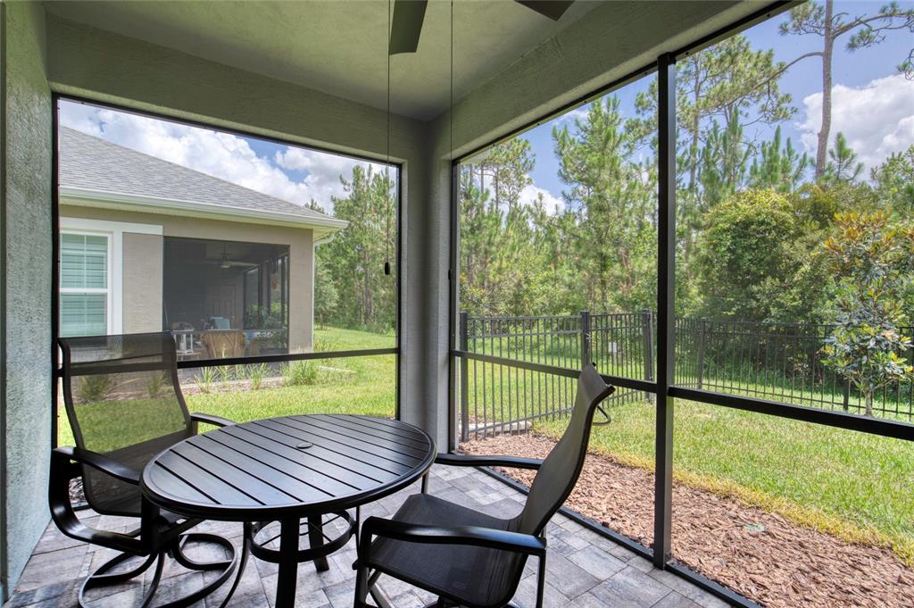 51 Wrendale Loop Ormond Beach, FL 32174 - Photo 34 of 58 a view of a porch with furniture and wooden floor