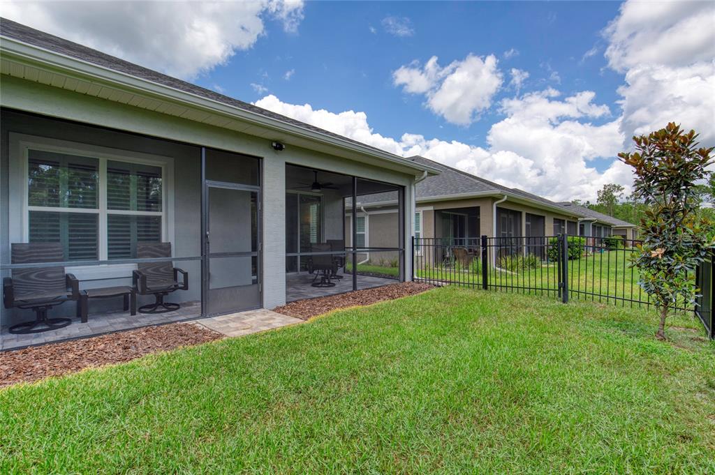 51 Wrendale Loop Ormond Beach, FL 32174 - Photo 38 of 58 a view of house with a backyard porch and sitting area