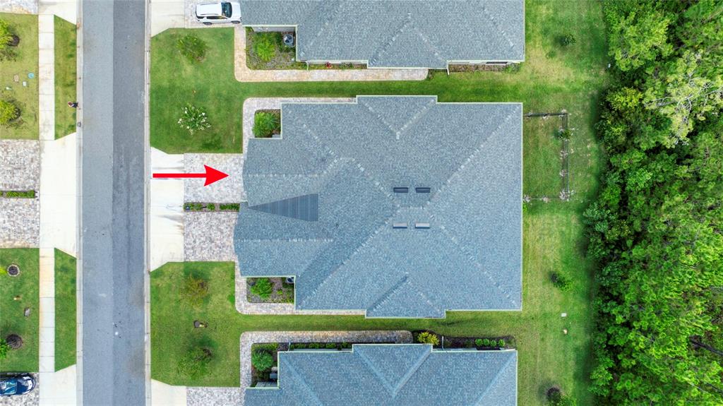 51 Wrendale Loop Ormond Beach, FL 32174 - Photo 42 of 58 an aerial view of a house with a garden and a yard