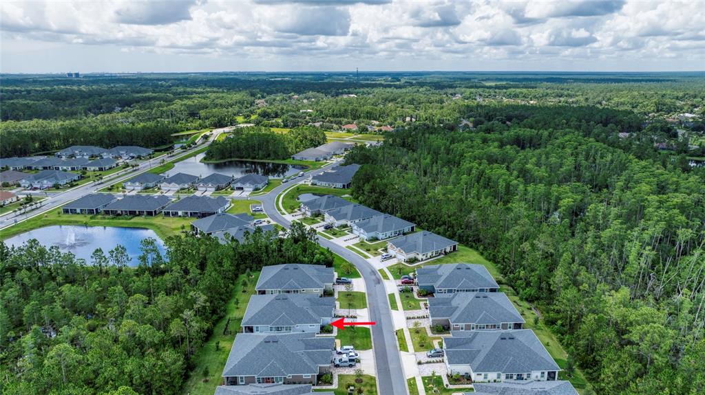 51 Wrendale Loop Ormond Beach, FL 32174 - Photo 45 of 58 an aerial view of a house with a yard and lake view