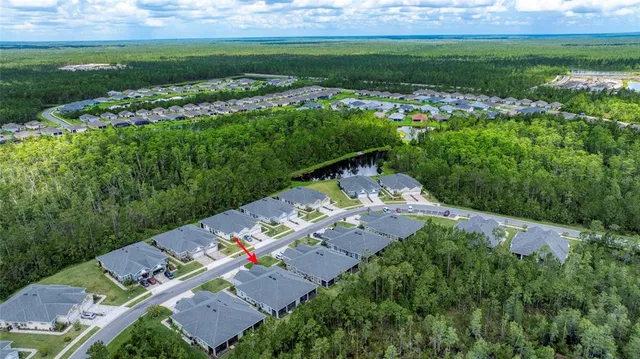a view of a house with backyard porch and sitting area