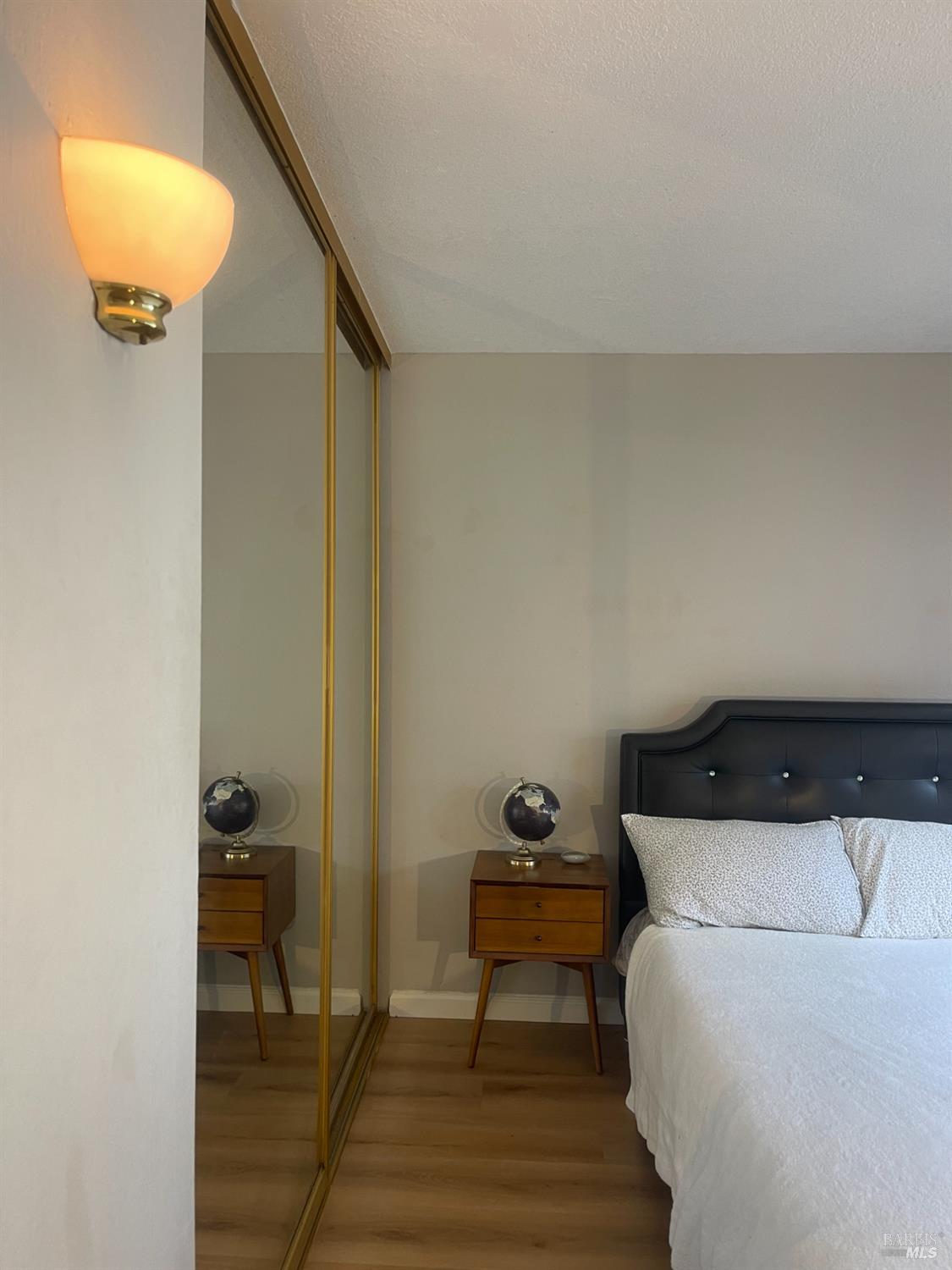 1 Embarcadero West, Unit 355 Oakland, CA 94607 - Photo 13 of 20 a bedroom with a bed and cabinets