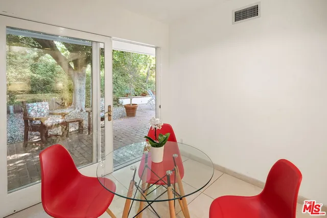 a view of a dining room with furniture wooden floor and windows