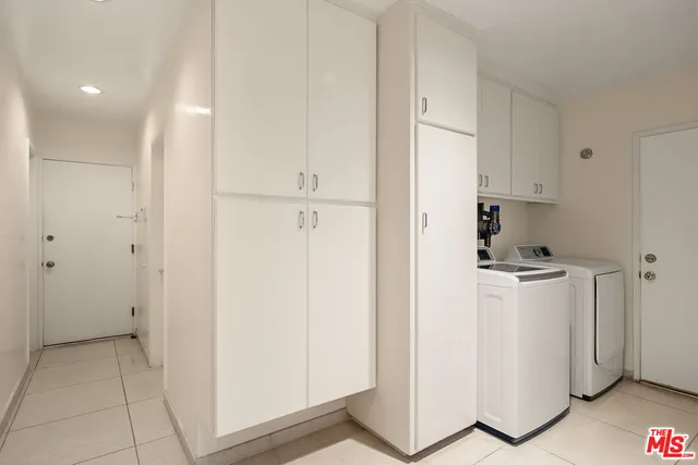 a view of a storage & utility room with washer and dryer