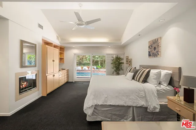 a spacious bedroom with a large bed and a window