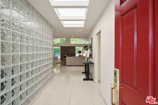 a view of hall way with furniture