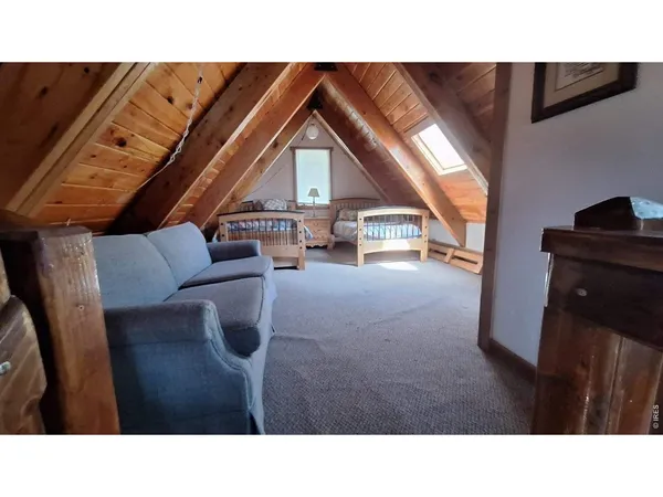 a upper view of living room with furniture and floor to ceiling window