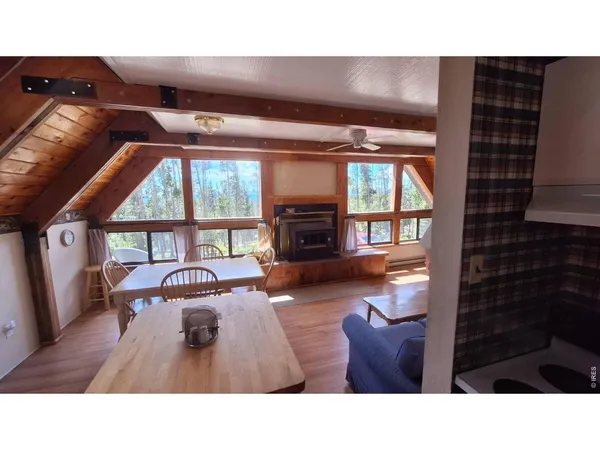 a kitchen with furniture and a fireplace