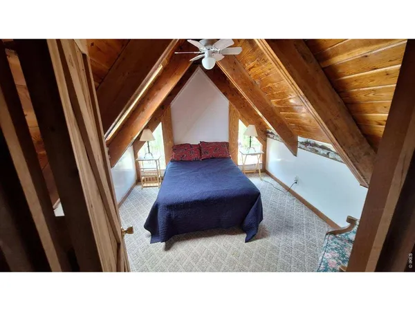 a balcony with furniture and wooden floor