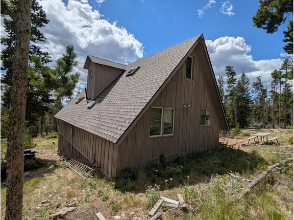 a backyard of a house with lots of green space