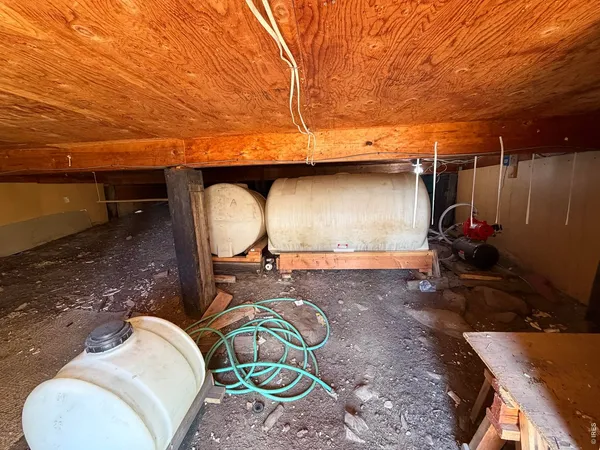 a backyard of a house with barbeque oven