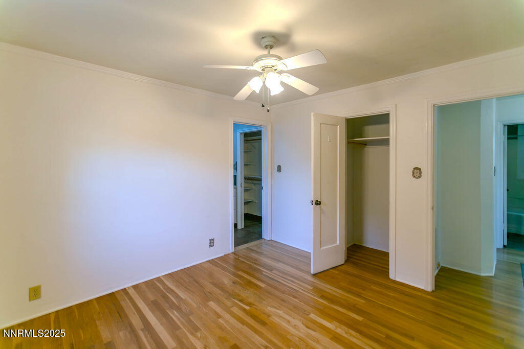 43 Ardmore Drive Reno, NV 89509 - Photo 14 of 28 wooden floor in an empty room with a chandelier fan
