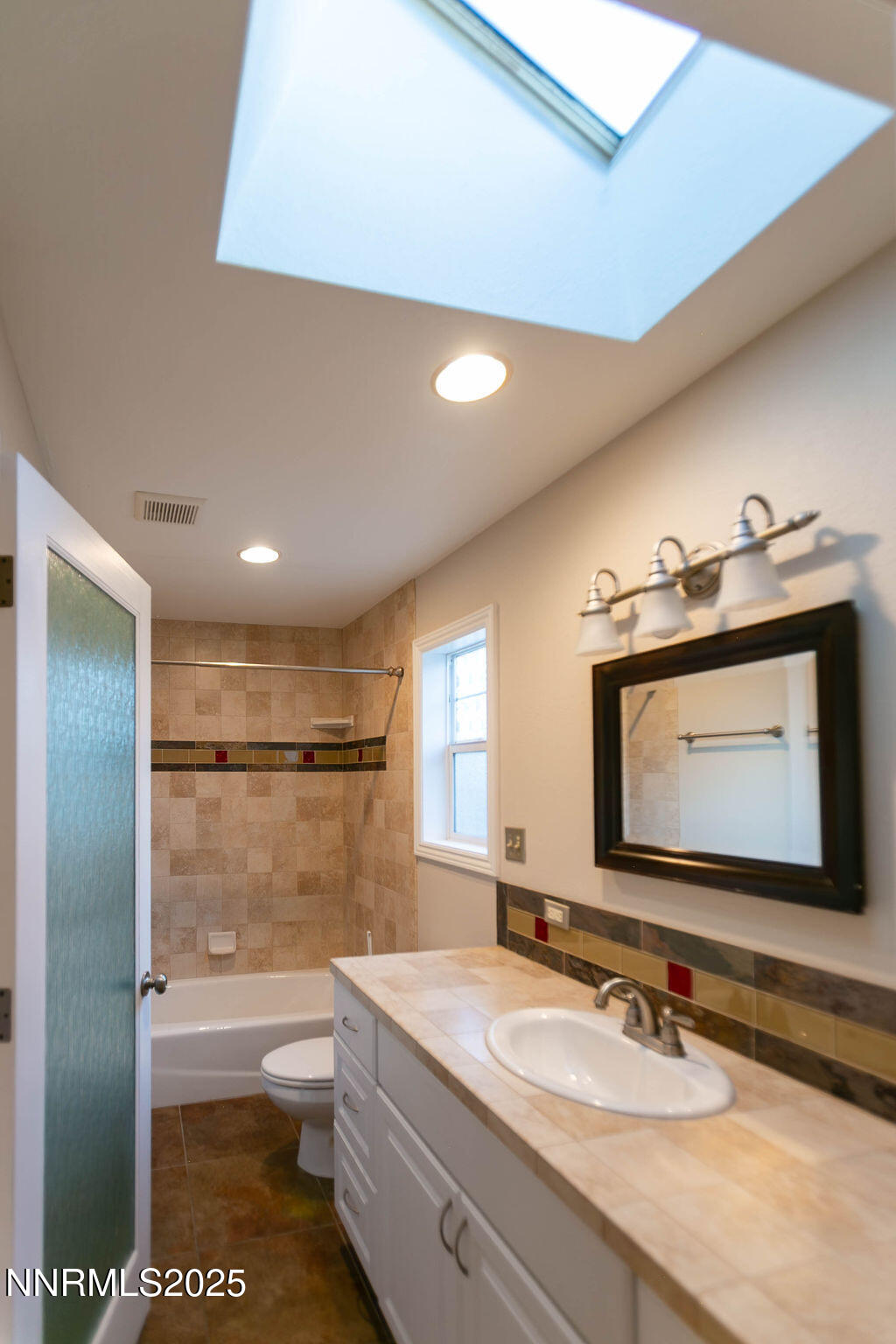 43 Ardmore Drive Reno, NV 89509 - Photo 15 of 28 a bathroom with a granite countertop sink a toilet and a mirror