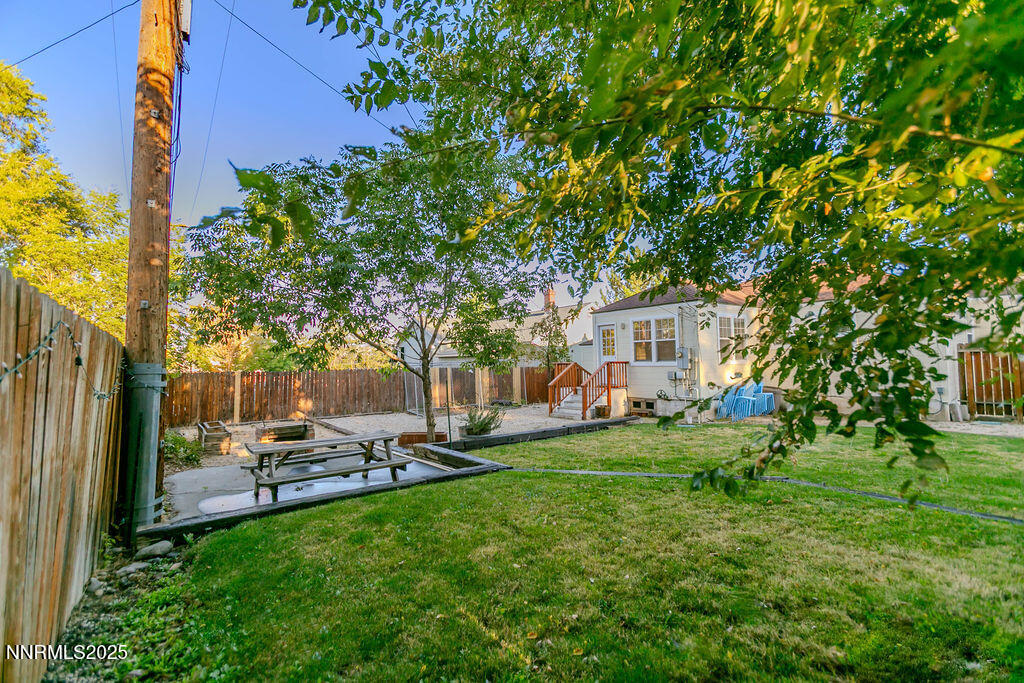 43 Ardmore Drive Reno, NV 89509 - Photo 24 of 28 a view of a backyard with table and chairs and a large tree