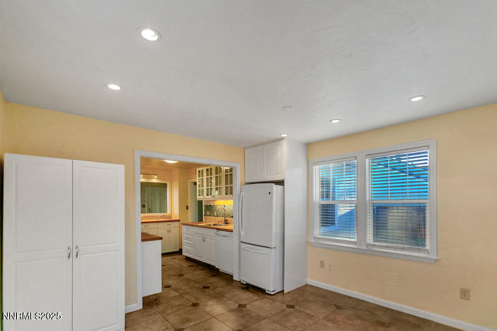 43 Ardmore Drive Reno, NV 89509 - Photo 8 of 28 a view of a kitchen with a refrigerator and a sink