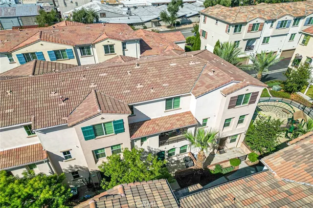 a aerial view of a house with a yard