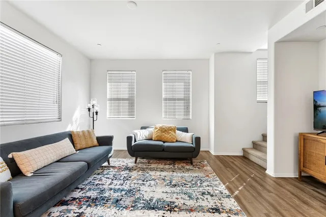 a living room with furniture and a rug