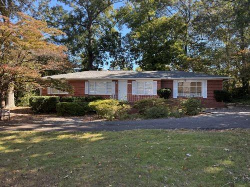 3674 Canton Road Marietta, GA 30066 - Photo 1 of 20 a front view of house with yard and green space