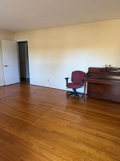 3674 Canton Road Marietta, GA 30066 - Photo 17 of 20 a view of a room with wooden floor and chair