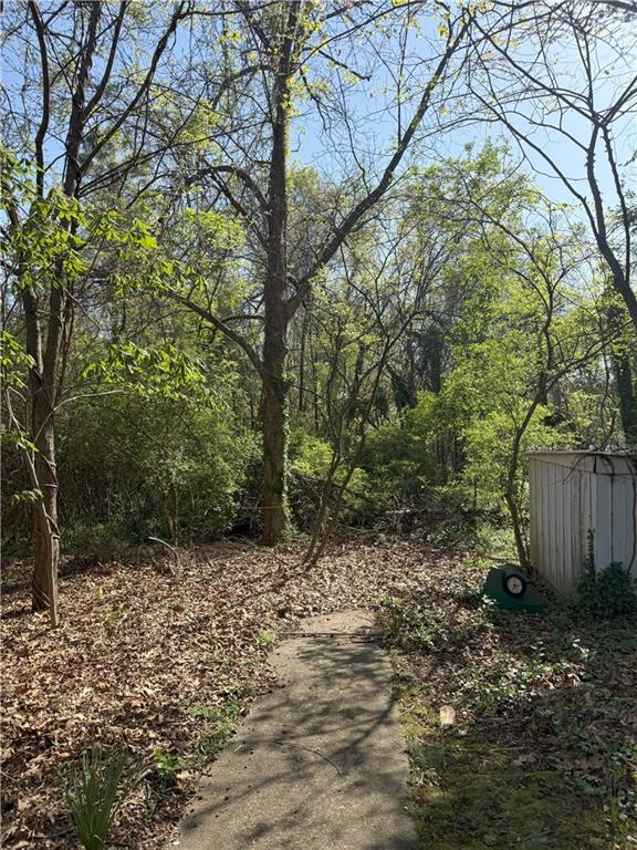 3674 Canton Road Marietta, GA 30066 - Photo 4 of 20 a backyard of a house with lots of green space