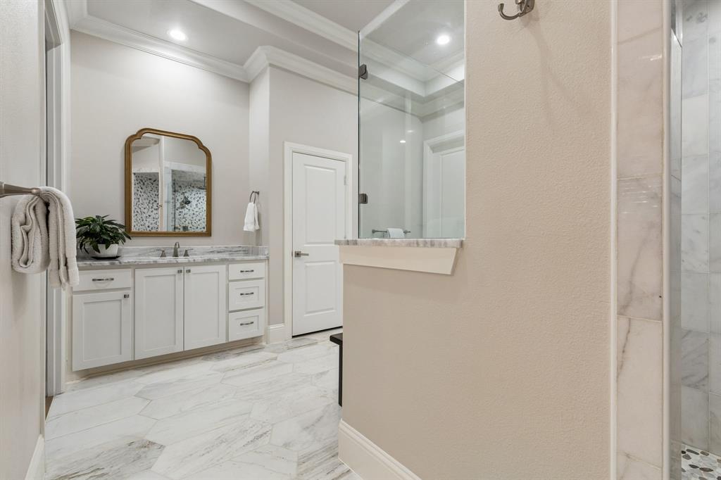 6700 Herbert Road Colleyville, TX 76034 - Photo 9 of 32 a bathroom with a double vanity sink mirror and