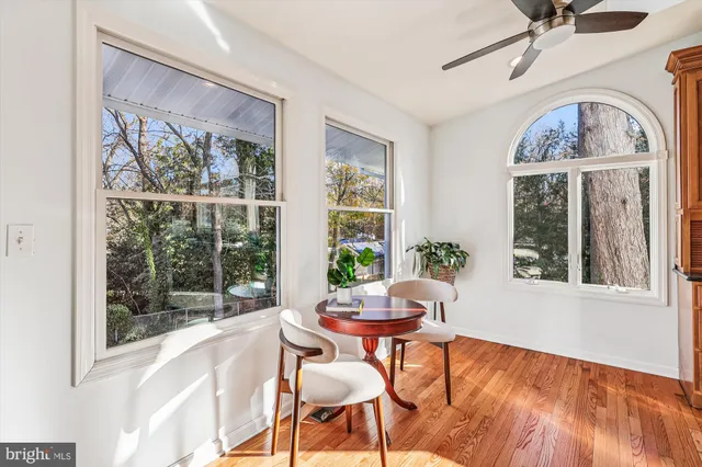 a spacious bedroom with a bed and a refrigerator