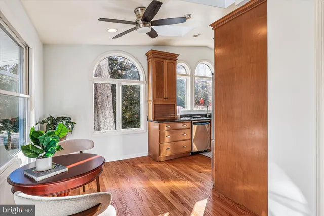 a view of a dining room with furniture and wooden floor