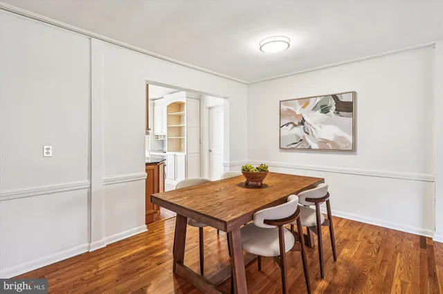 a living room with furniture a fireplace and a large window