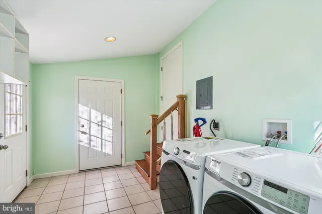 a bedroom with a bed and a ceiling fan
