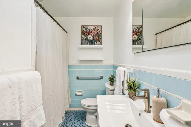 a view of a workspace with a table and chair in a room