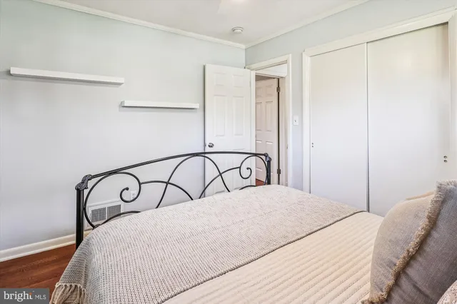 a living room with furniture gym equipment and a rug