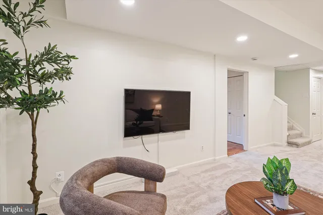 a view of an empty room with window and closet