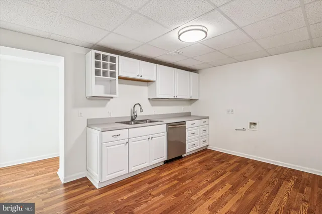 a bathroom with a sink toilet and mirror