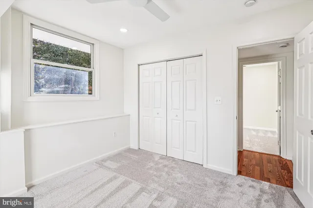 a view of a livingroom with furniture and a window