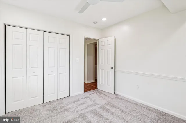 a backyard of a house with barbeque oven table and chairs