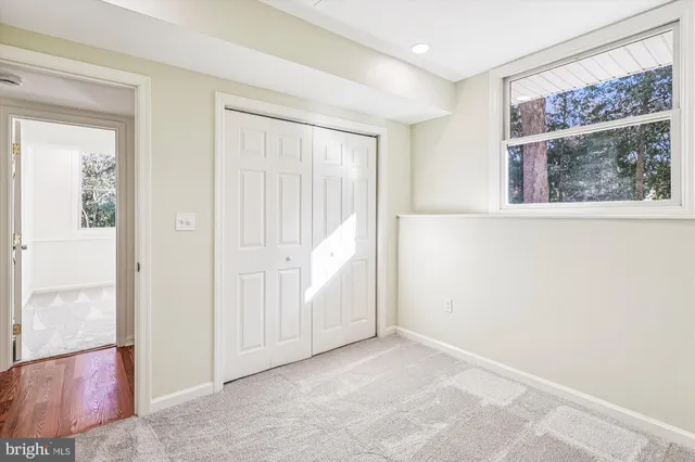 a backyard of a house with yard and outdoor seating