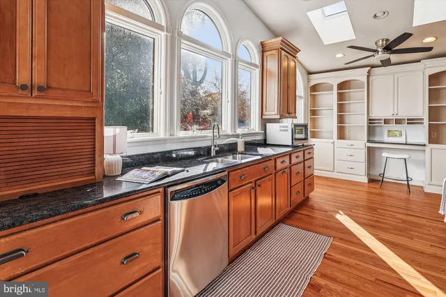 a living room with a furniture and a book shelf