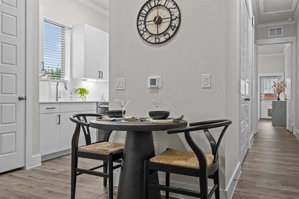 3279 Ganzer Road West, Unit 125B Denton, TX 76207 - Photo 7 of 25 a view of a dining room with furniture and wooden floor