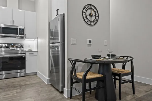 a view of a dining area with furniture and wooden floor