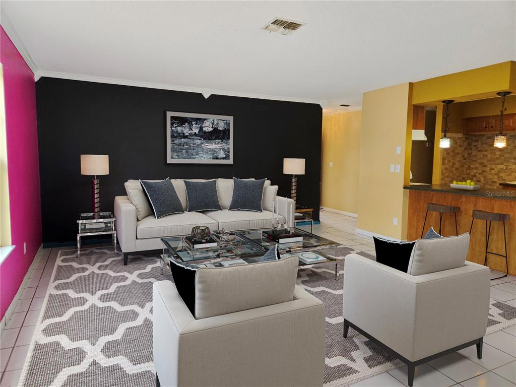 19 Spring Dr Place Ocala, FL 34472 - Photo 8 of 29 a living room with furniture and a rug