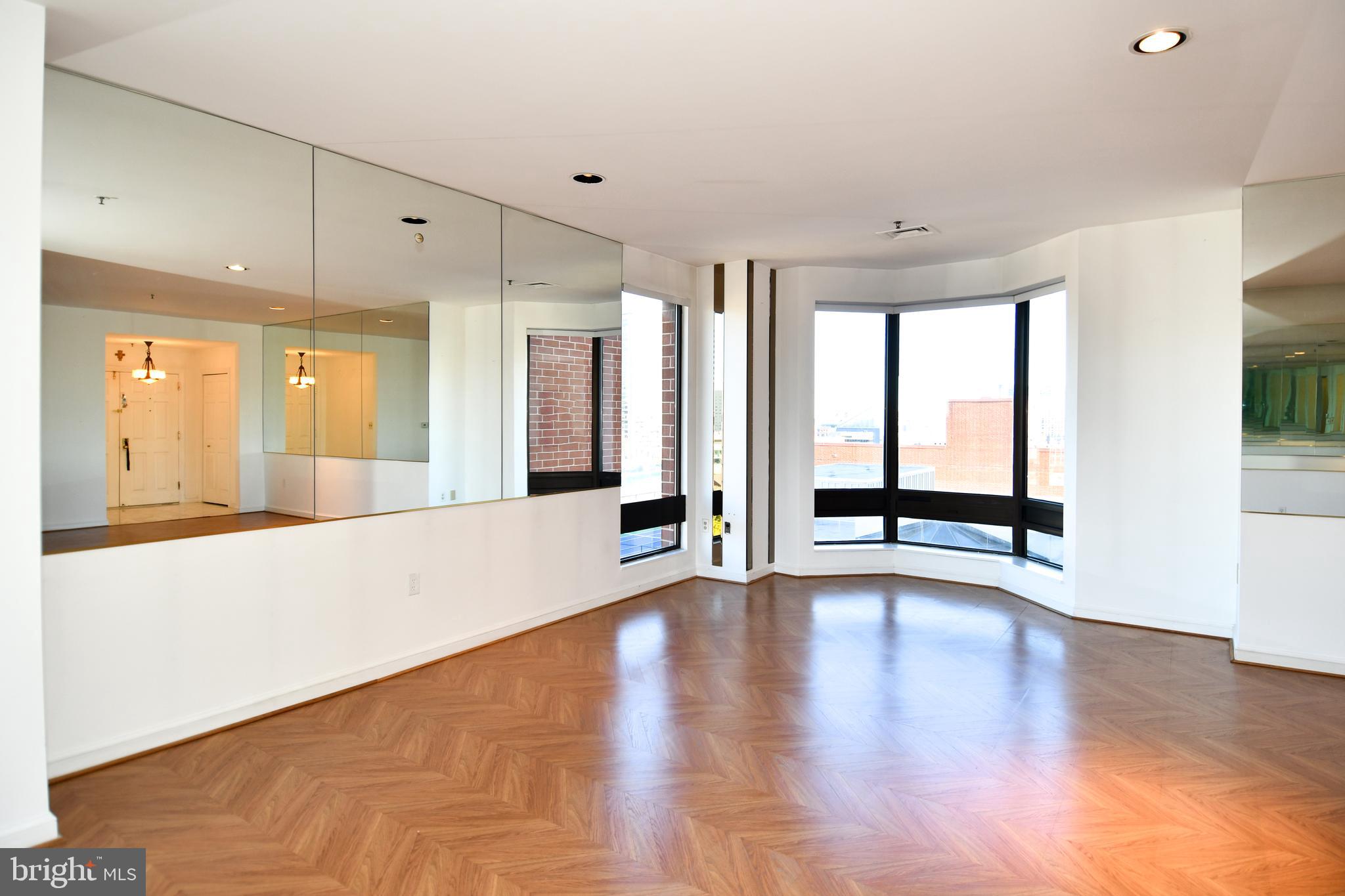 10 East Lee Street, Unit 809 Baltimore, MD 21202 - Photo 12 of 58 a view of an entryway with wooden floor