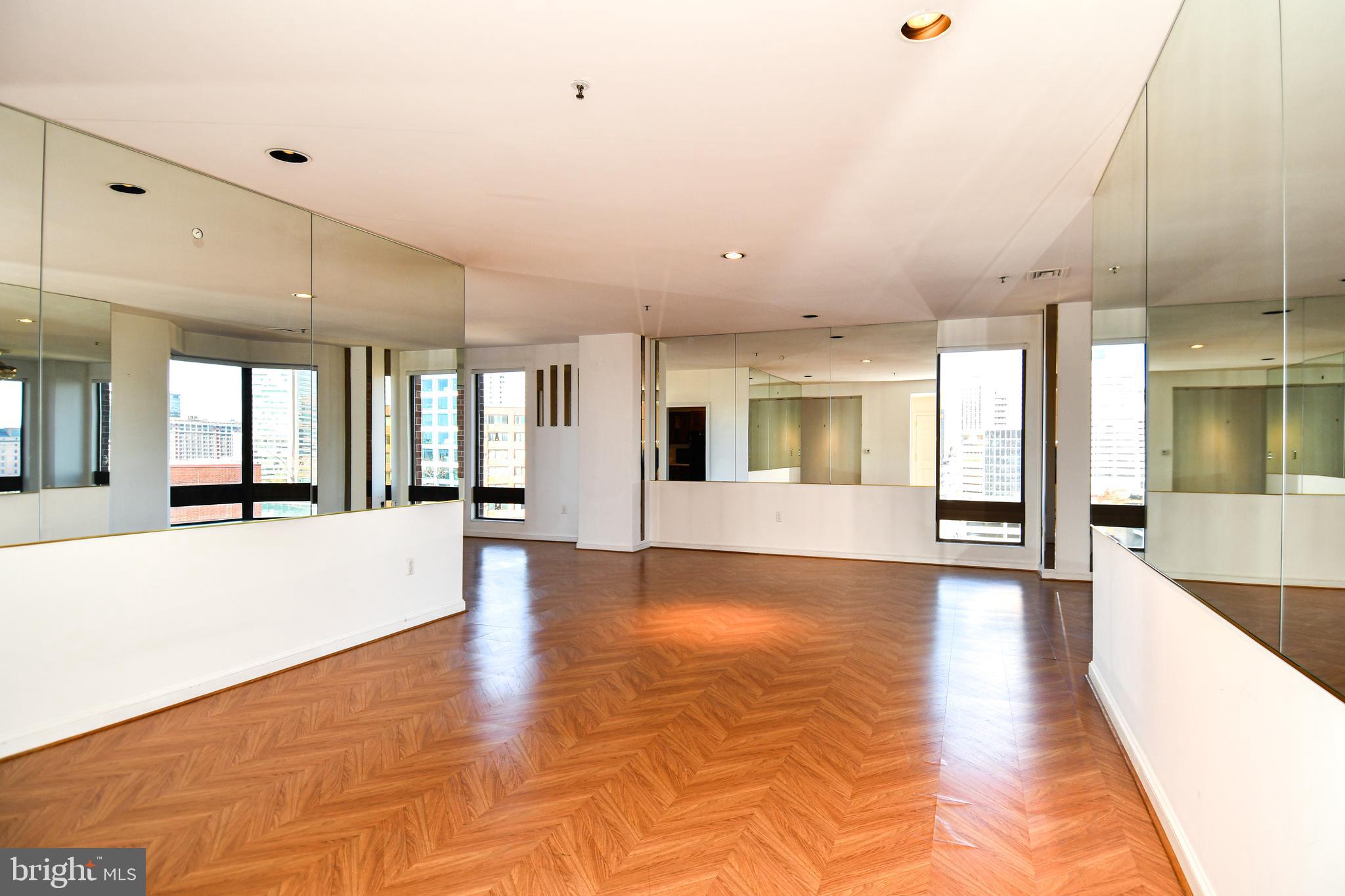 10 East Lee Street, Unit 809 Baltimore, MD 21202 - Photo 3 of 58 a view of an entryway with wooden floor