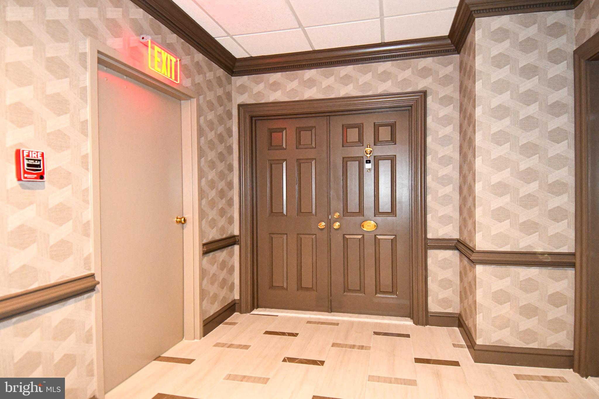 10 East Lee Street, Unit 809 Baltimore, MD 21202 - Photo 8 of 58 a view of a hallway with a outdoor space