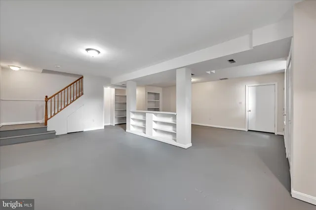 a view of empty room with white walls