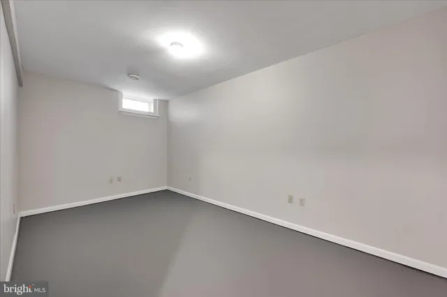 an empty room with a empty space and window