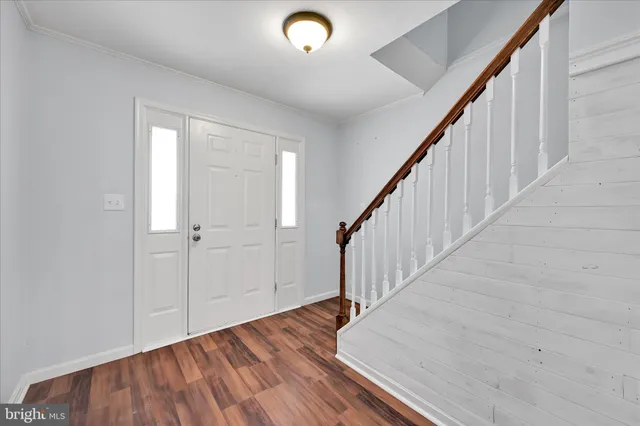 a view of entryway with wooden floor
