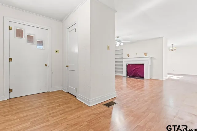 a view of a room with wooden floor