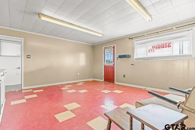 a view of an empty room with a window