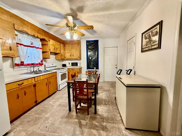 a view of kitchen with cabinets and outdoor counter space