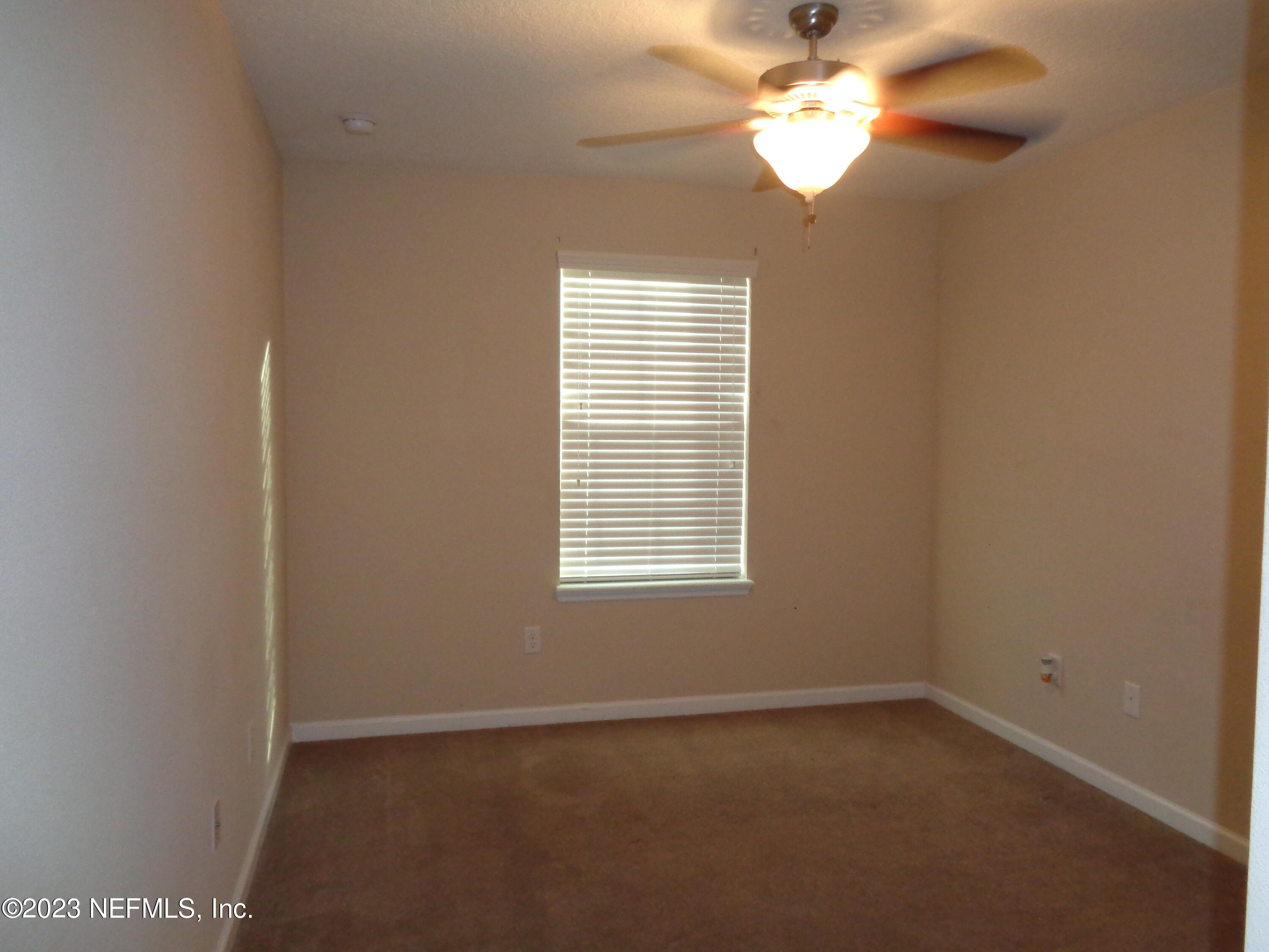 3786 Chasing Falls Road Orange Park, FL 32065 - Photo 13 of 26 a view of an empty room with a window